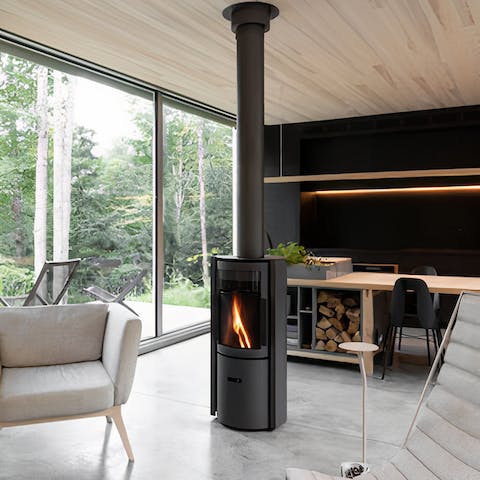 Throw another log in the 360° rotating fireplace