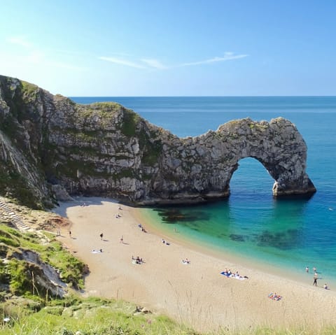 Visit the striking Durdle Door, a thirty-three minute drive away on the Jurassic Coast