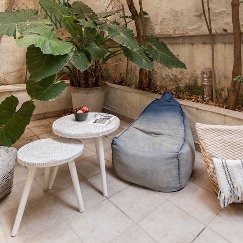 Relax under the sun with a cup of coffee in the outdoor space