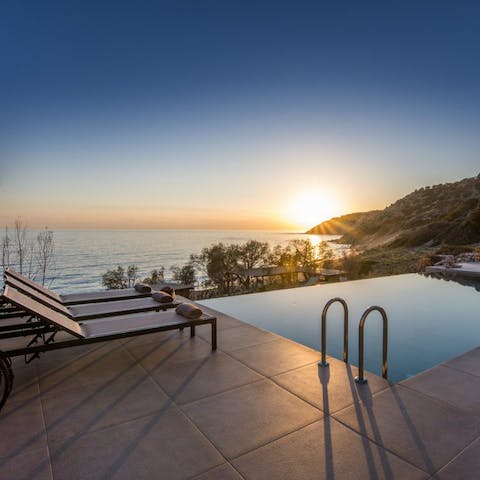 Watch the picturesque sunset while you relax in the calm waters of the infinity pool