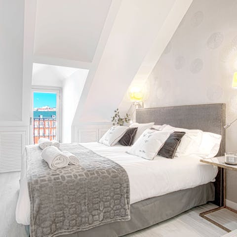 Wake up in the comfortable bed and take in morning views of Plaza Mayor from the Juliet balcony