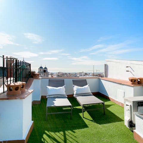 Catch some rays on the private roof terrace's deck chairs