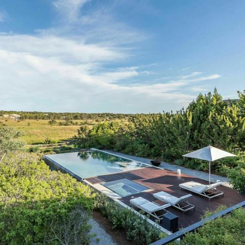 Swim in the modern pool overlooking the endless dunes of the nature reserve