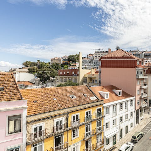 Look out over the wide boulevards of Príncipe Real, lined with pastel-hued apartment buildings