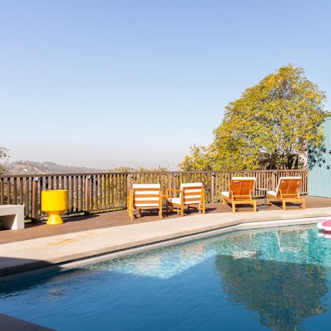 Admire the view of the Hollywood Hills from the pool