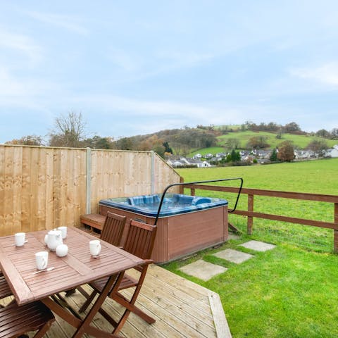 Soak in your private hot tub with a view