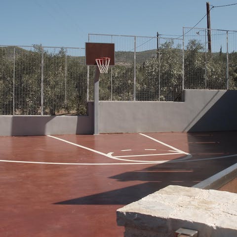 Challenge your group to a game of basketball on the shared courts