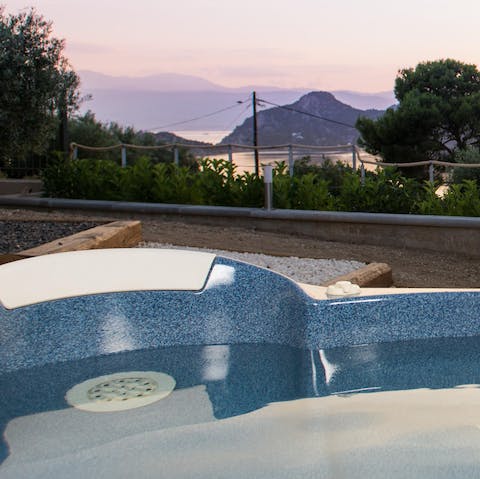 Relax in the jacuzzi as you take in the views over Lake Vouliagmeni