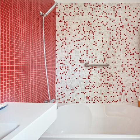 Treat yourself to a long soak in the beautifully tiled bathroom's tub