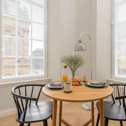 Start the day with a quick breakfast around the table, admiring the views of bustling streets