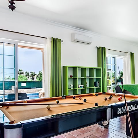 Come into the shade and enjoy a game of pool in the living room