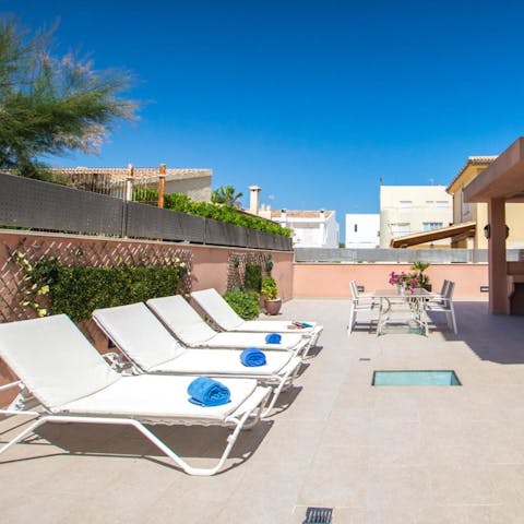 Soak up the Mallorcan sunshine from the loungers on the terrace 