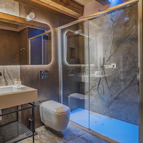 Pamper yourself with a soak beneath the swish bathroom's chromotherapy rainfall shower