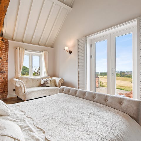 Gaze out over the rolling countryside from the comfort of your bed