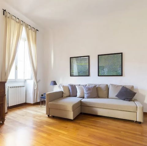 Kick back in the bright living room with a glass of Italian wine after a day of touring the city