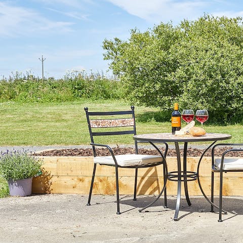 Share a bottle of wine on the patio, soaking up the sunshine