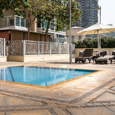 Cool off from the Dubai sunshine at the communal pool 