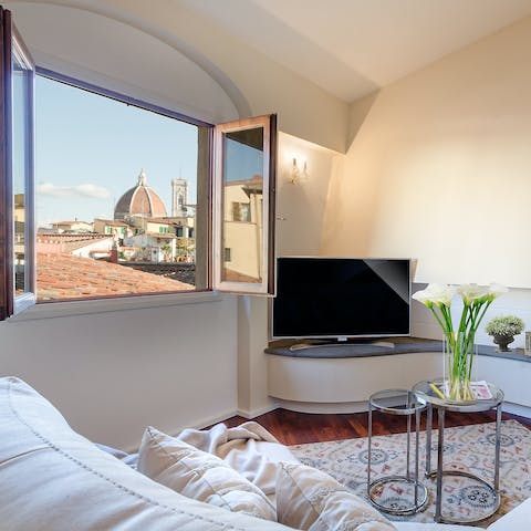 Admire views of the Florence Cathedral from the comfort of the bright living room