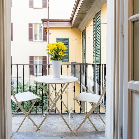 Take your aperitivo on the little balcony