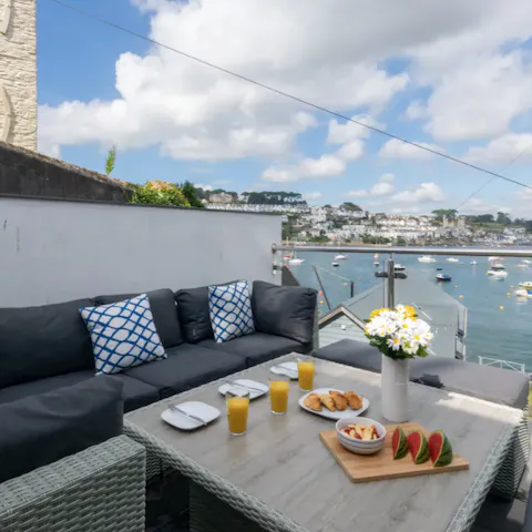 Enjoy your breakfast each morning on the private deck with river views
