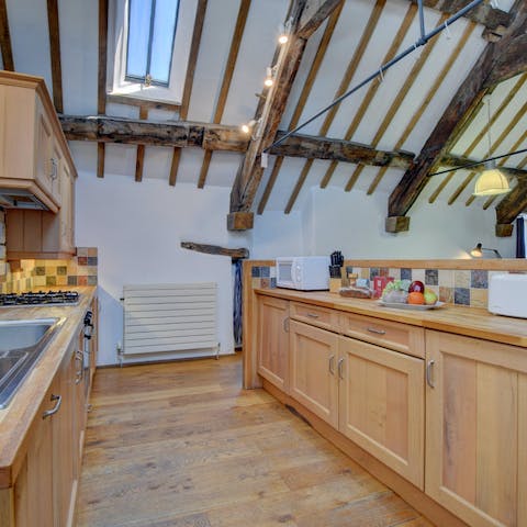 Cook for the group in the open-plan kitchen