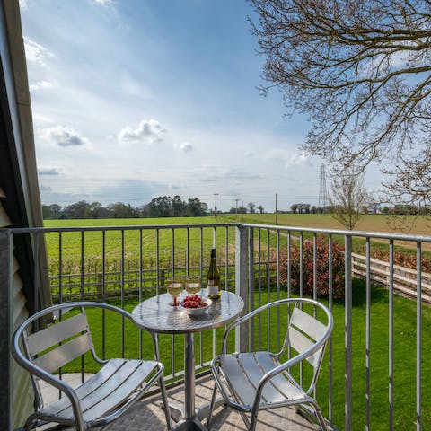 Enjoy rolling countryside views as you sip a glass of wine