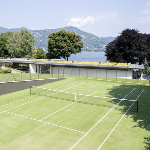 Get active in the sun on the private tennis court