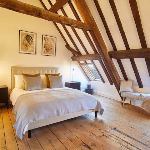 Have a dreamy sleep under the rustic wooden beams in the bedroom