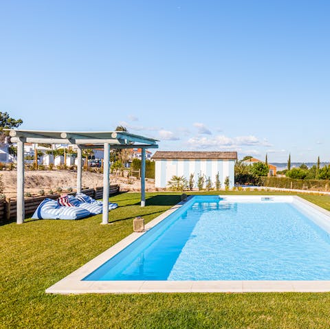 Enjoy a slow pace of life with poolside sunbathing and Portuguese picnics