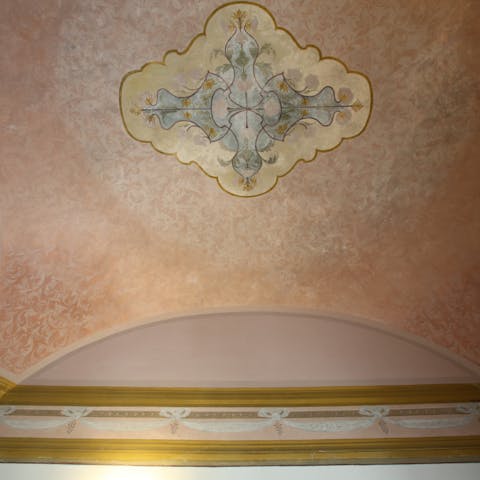 Gaze up at the spectacular frescoed ceilings from the comfort of your bed