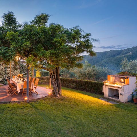 Tuck in to barbecue dinners while sitting beneath the trees, with a breathtaking view of the Tuscan hills