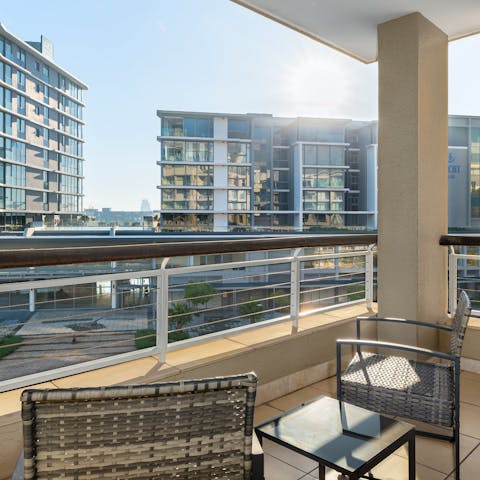 Find a sunny spot on the balcony to enjoy a drink