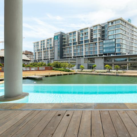 Enjoy a refreshing dip in the shared pool overlooking the canal