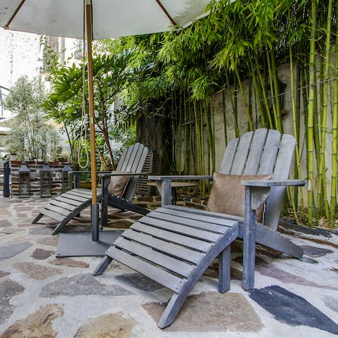 Lounge in the cobbled courtyard on the recliner chairs