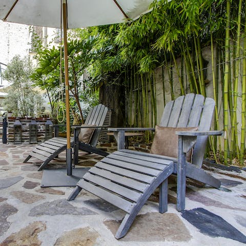 Lounge in the cobbled courtyard on the recliner chairs 