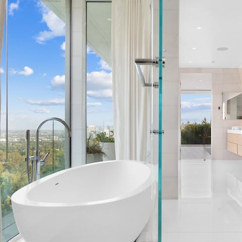 Enjoy the scenery from the freestanding bathtub