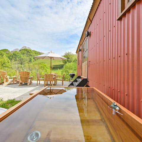 Unwind in the comforting waters of the wood-fired spa bath