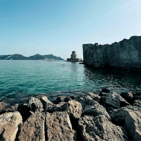 Explore Methoni, a small historic village with a 13th-century castle and sandy beach