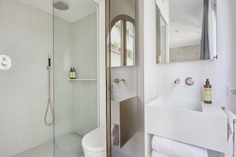 Wake up refreshed under the rainfall shower of your resort-like bathroom