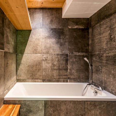 Treat yourself to a well-earned soak in the contemporary bathtub
