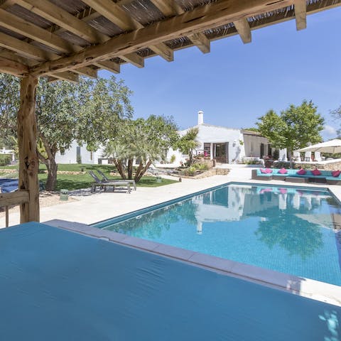 Escape the sun and take a nap in the poolside cabana