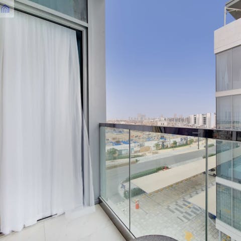 Take in the warm Dubai air on the private balcony