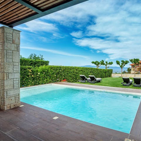 Take a dip in the pool or hot tub under the blue skies