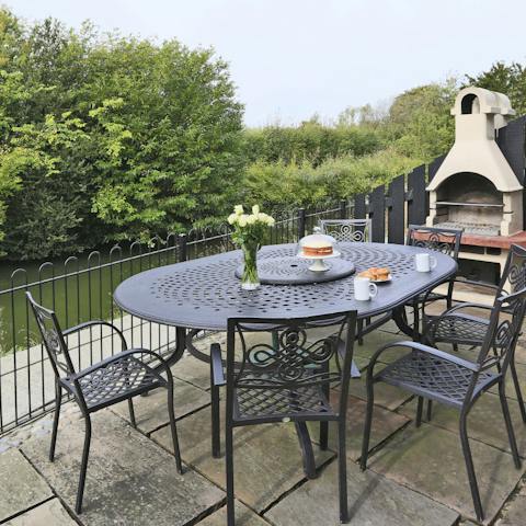 Barbecue outside with majestic views out onto the 12th century moat