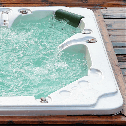 Unwind in the hot tub after a day of exploring the local countryside 