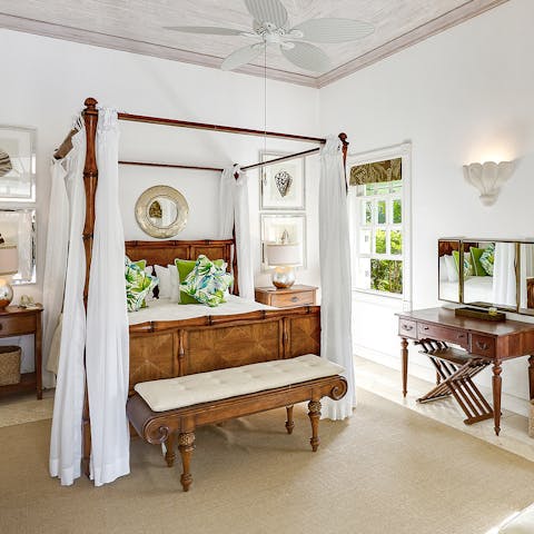 Unwind in the beautiful four poster bed