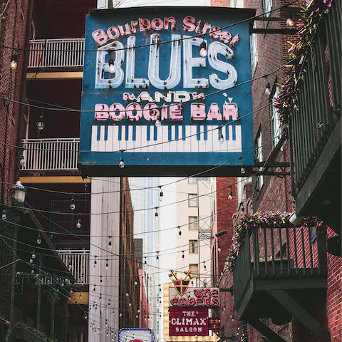 Take a stroll through Bourbon Street, eight minutes away on foot