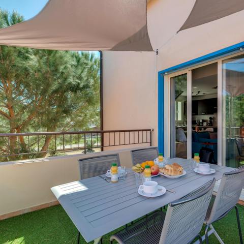 Tuck into breakfast on the balcony before heading out for the day