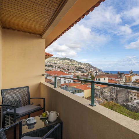 Sit out on the private balcony and look out toward Funchal Bay