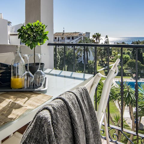 Enjoy breakfast on the balcony with a side of sea views